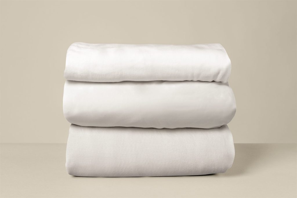 Stack of clean folded bed linen